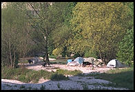 Homeless camp in the river.  Downtown Munich next to Deutsches Museum.
