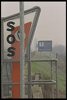 Everything for the Fiat owner:  an emergency phone and a sign directing you to the next mechanic