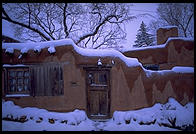Adboe house and snow. Santa Fe, New Mexico