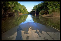 A road disappears into the flooded Mississippi River near St. Charles, Missouri in 1993.