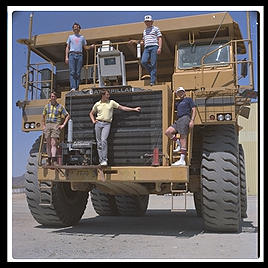 Just your average $750,000 1200-horsepower mining truck, at Caterpillar's Arizona Proving Grounds in Goodyear (east of Phoenix).  I wrote some Lisp software to coordinate earthmoving operations and CAT was testing it.  That's me in the blue Consolve T-shirt on the right